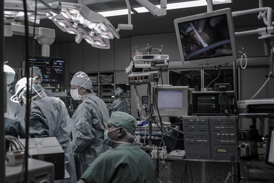 Surgical team wearing scrubs inside an operating room using wireless equipment